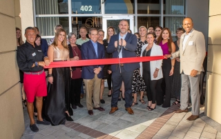 Edge Success Showroom Opening Group photo cutting ribbon